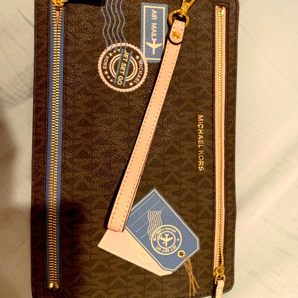 Brand new, limited travel edition authentic travel flat mini Michael Kors clutch